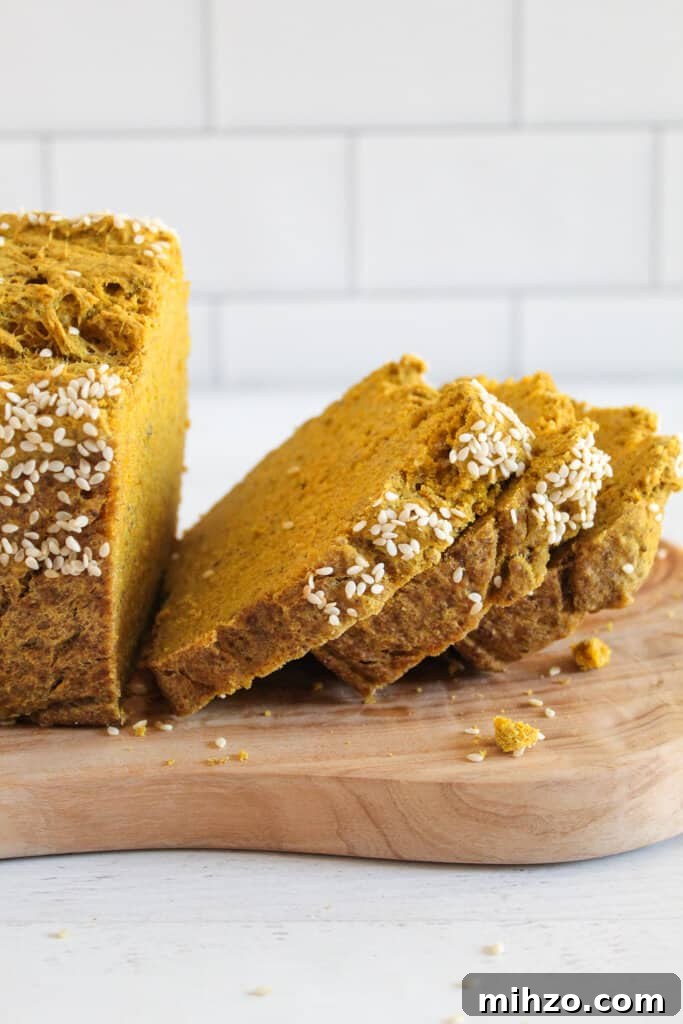 Sliceable Chia Seed Bread for Gluten-Free Toasts & Sandwiches 2 slices of chia seed bread on a cutting board.