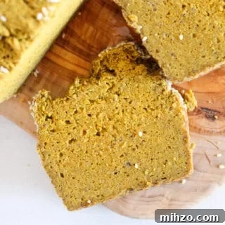 Sliceable Chia Seed Bread for Gluten-Free Toasts & Sandwiches 5 slice of chia seed bread on a cutting board.