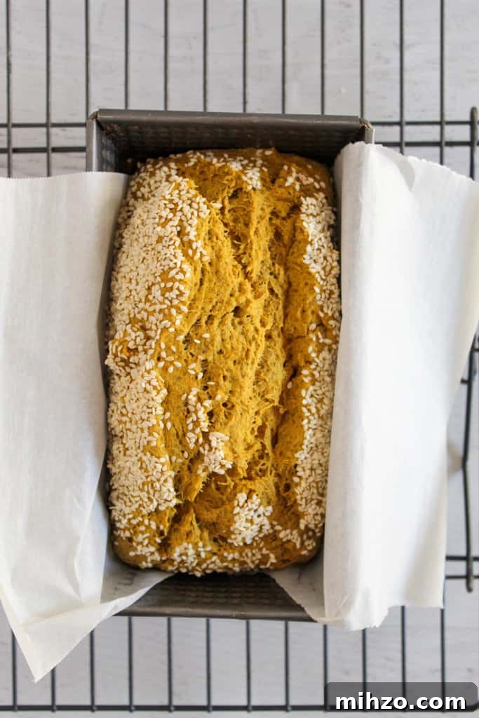 Sliceable Chia Seed Bread for Gluten-Free Toasts & Sandwiches 8 baked loaf of chia seed bread in a baking pan.