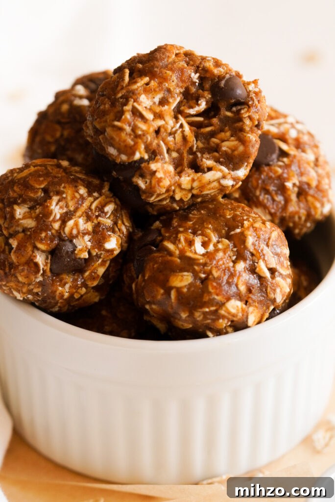 Pumpkin Spice Protein Bites — No-Bake Autumn Snack 2 Small white bowl full of pumpkin spice protein balls