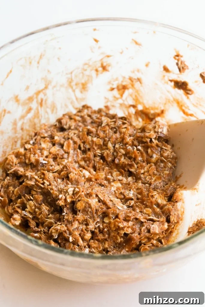 Pumpkin Spice Protein Bites — No-Bake Autumn Snack 6 protein ball mixture without chocolate chips in a mixing bowl