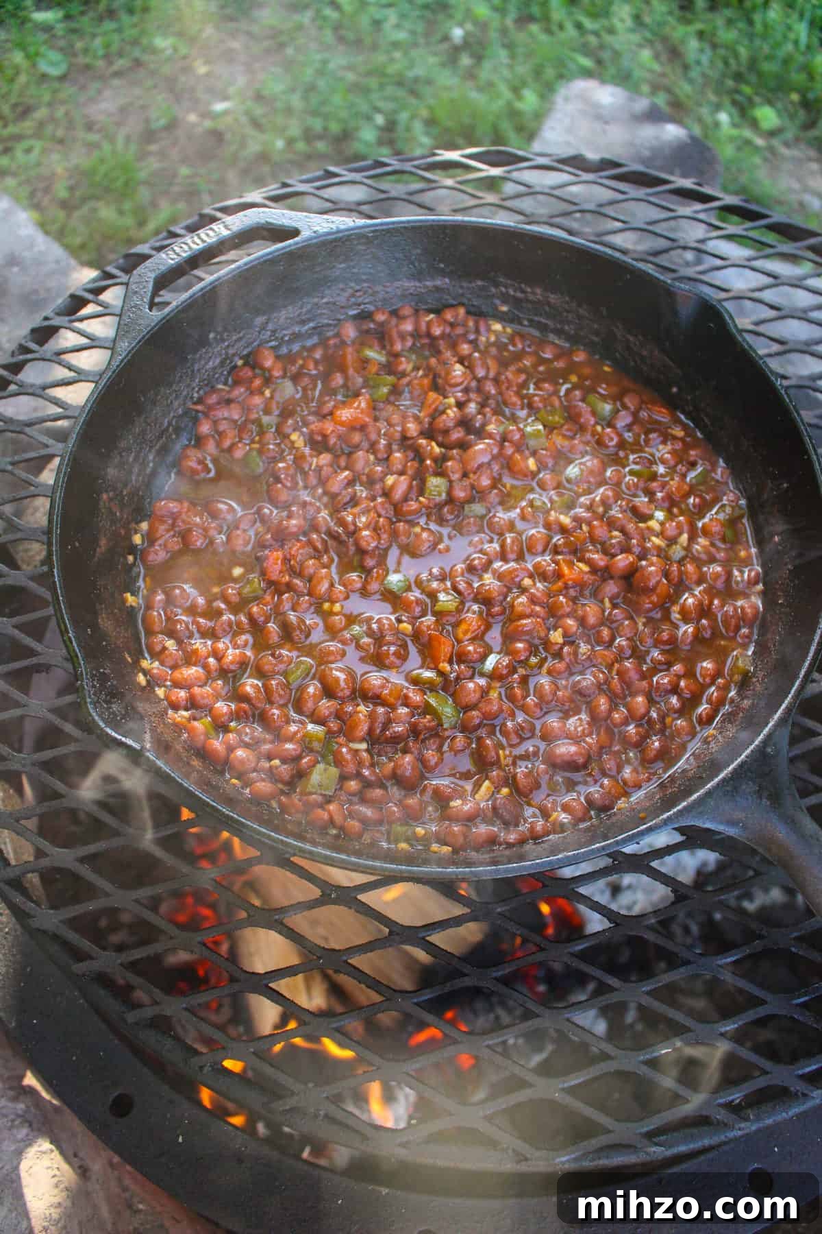 overhead of a skillet filled with spicy pinquito beans
