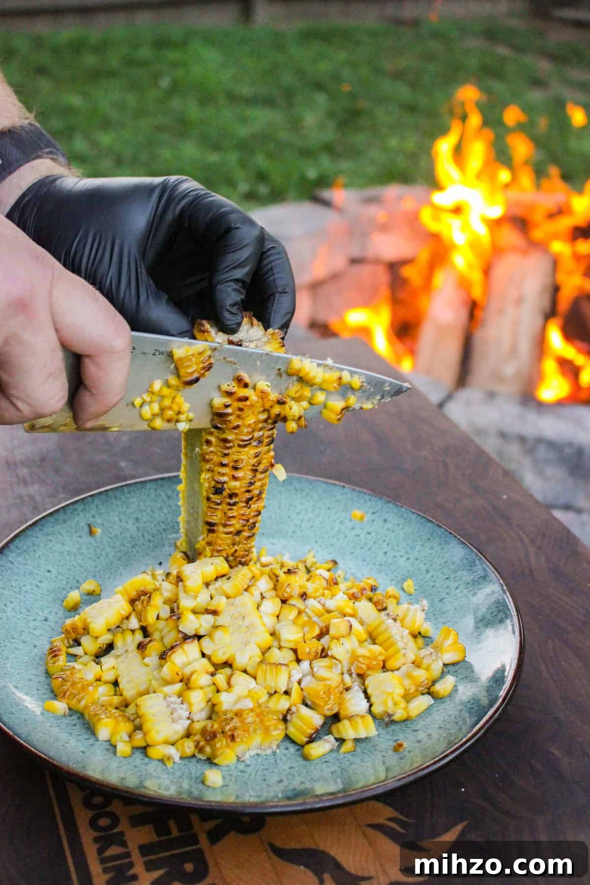 corn being sliced off of the cob