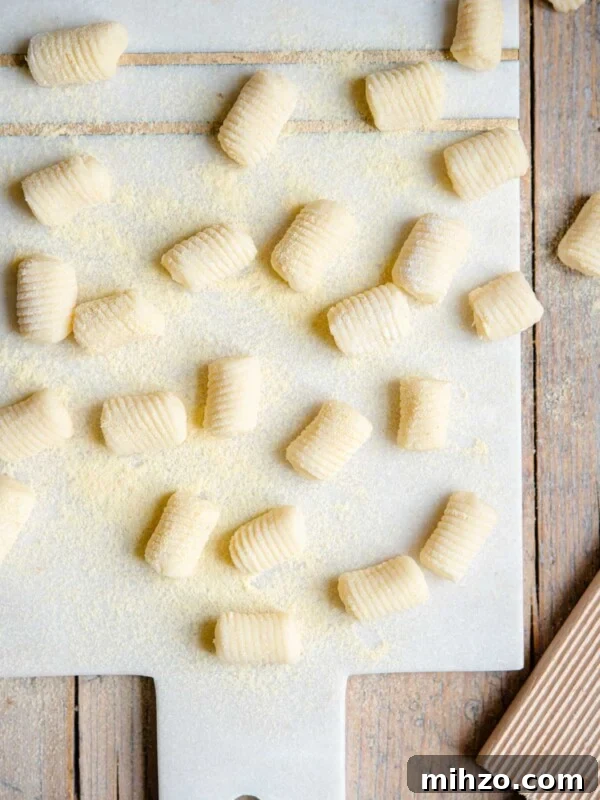 An overhead shot of gnocchi on a cutting board