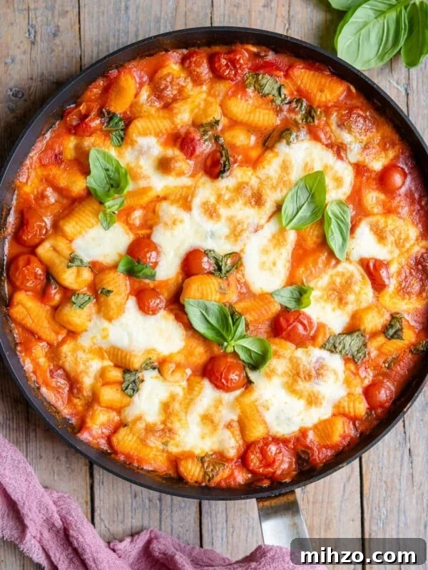 An overhead shot of baked gnocchi in a skillet