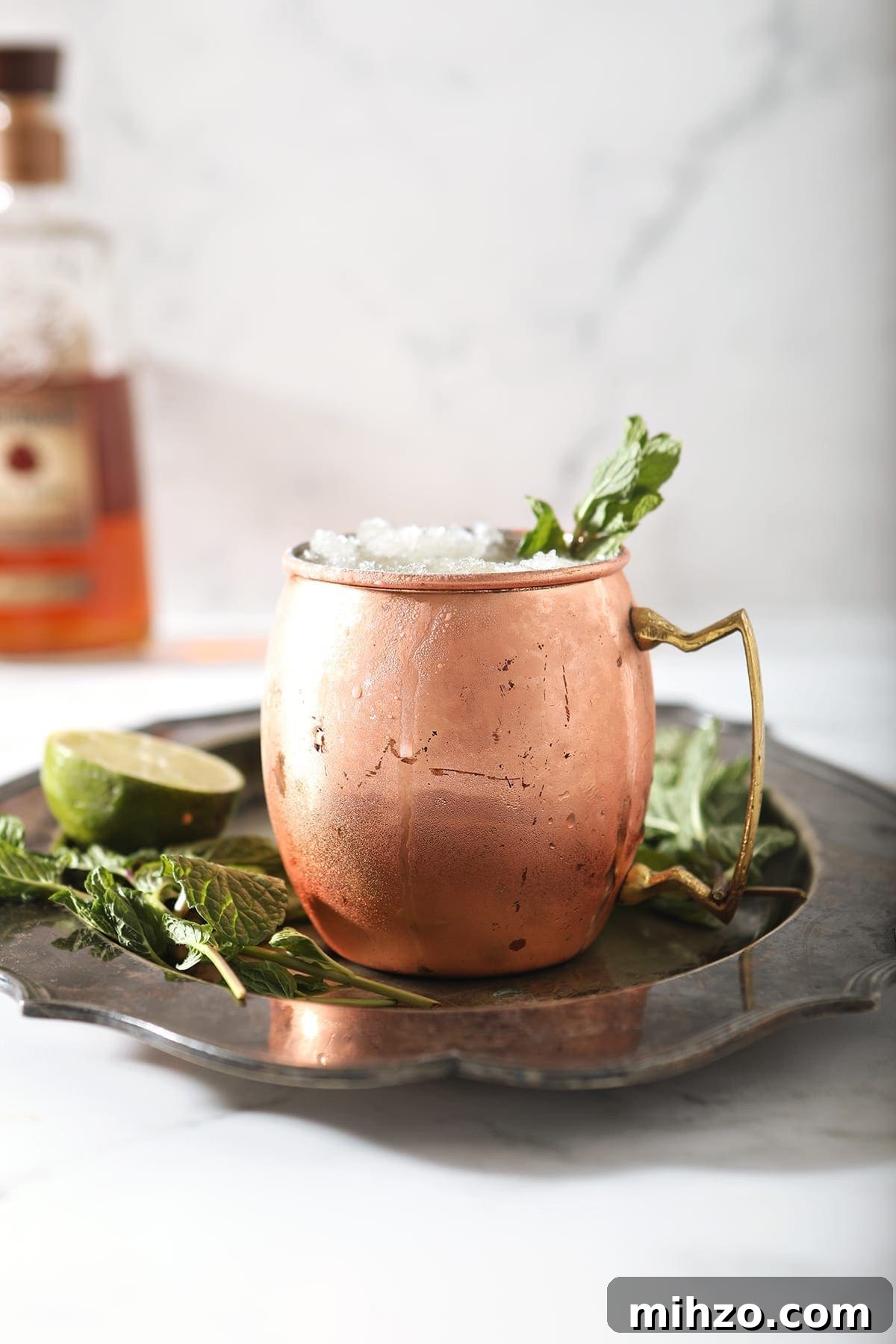 A copper mug holds a Kentucky Mule