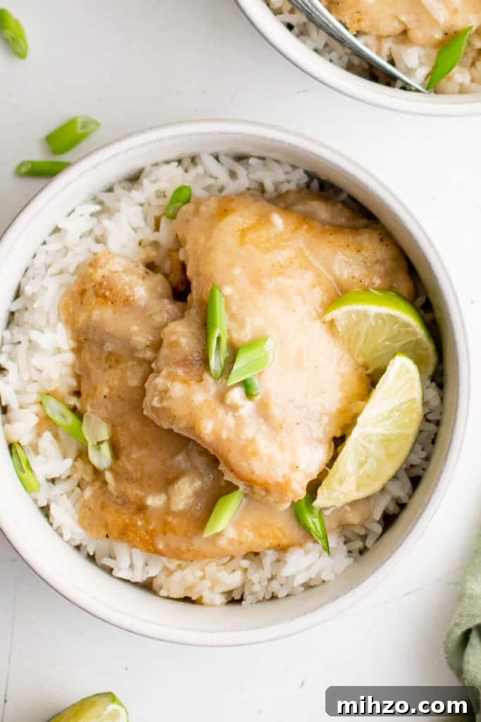 Lime wedges on top of cooked chicken thighs.