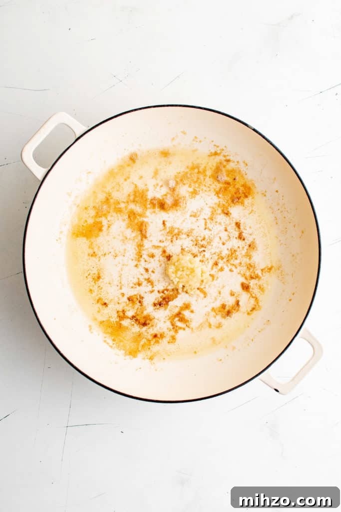 Garlic cooking in a pan.