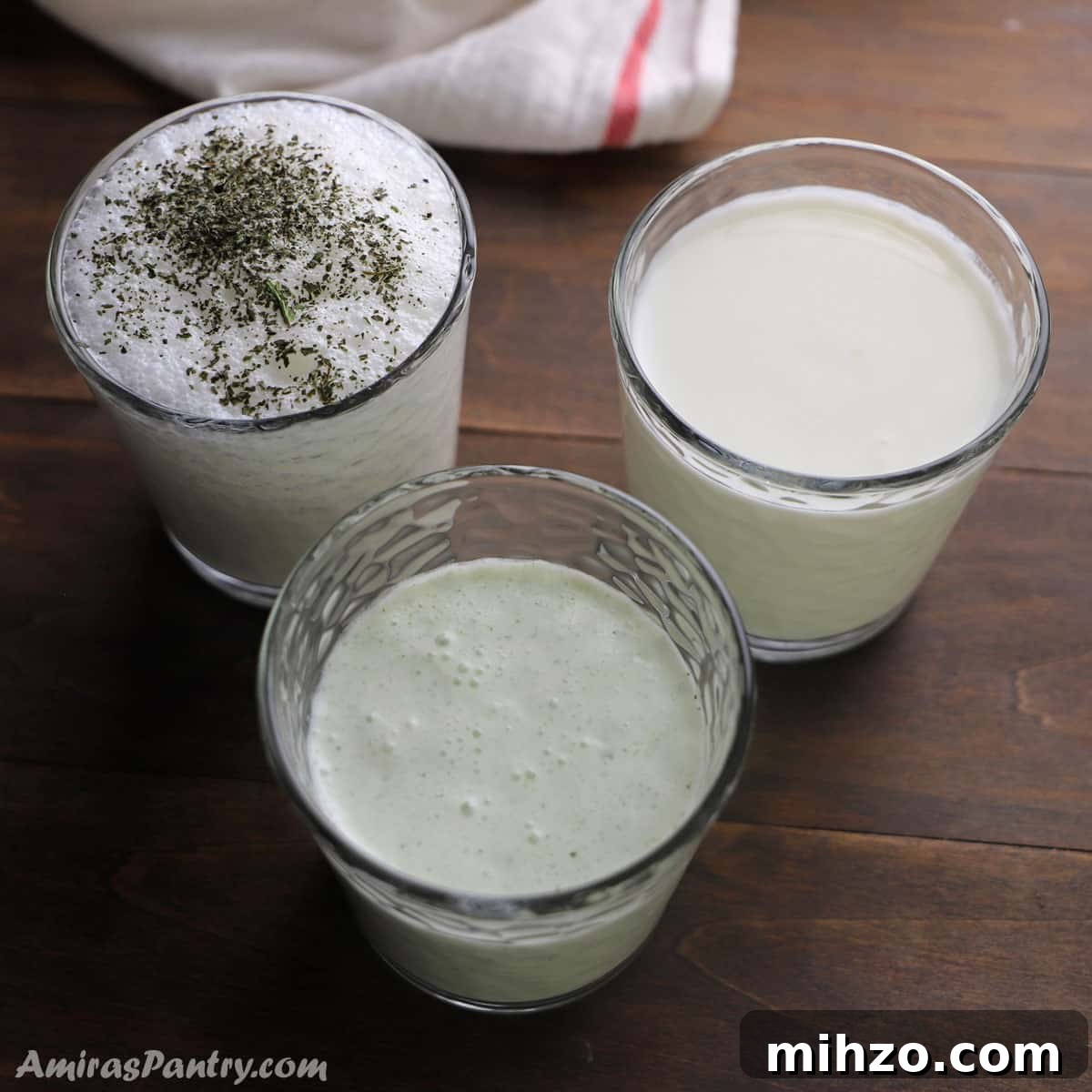 Ayran: Refreshing Turkish Yogurt Drink Recipe and Guide 2 3 cups of different flavors of Ayran placed on a wooden surface.