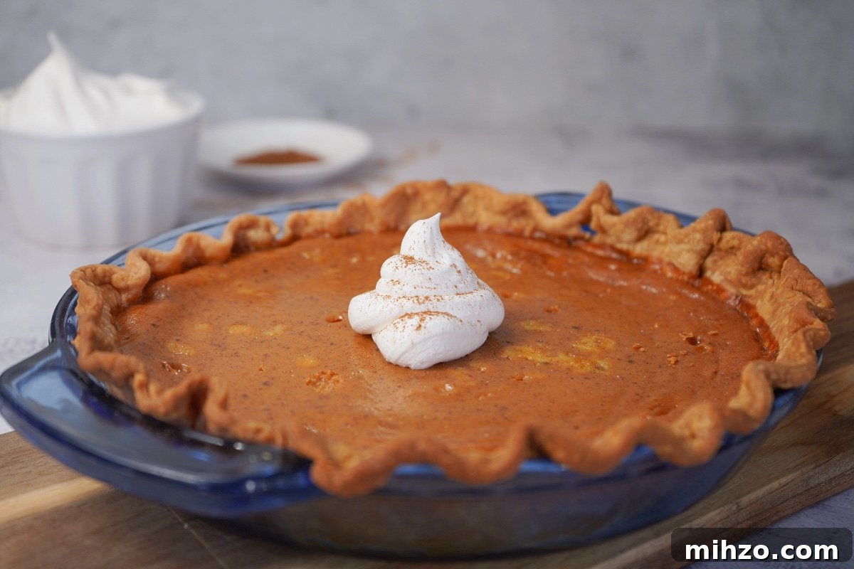 Smoked pumpkin pie in blue pie dish