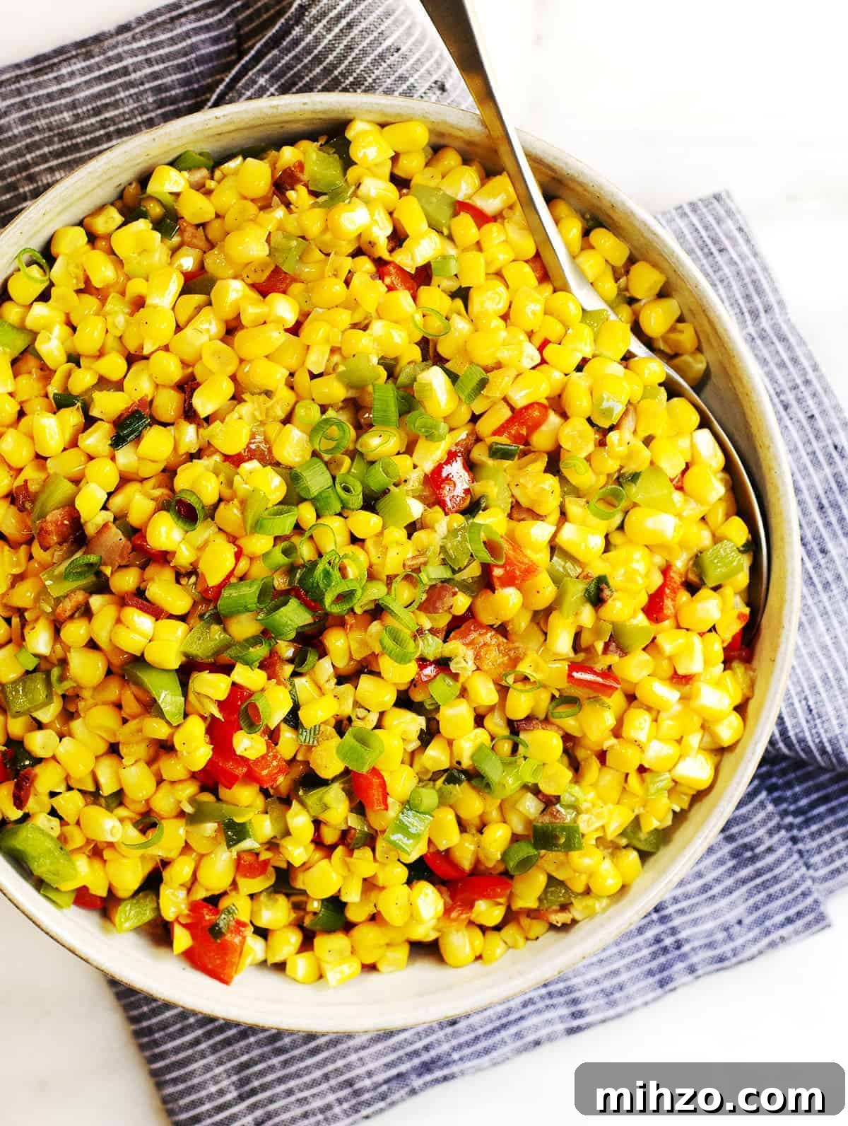 Authentic Cajun Maque Choux Recipe with Sweet Corn and Bacon 9 Corn Maque Choux served in a gray ceramic bowl photo from above