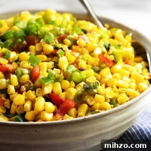 Authentic Cajun Maque Choux Recipe with Sweet Corn and Bacon 10 Corn Maque Choux served in a gray ceramic bowl