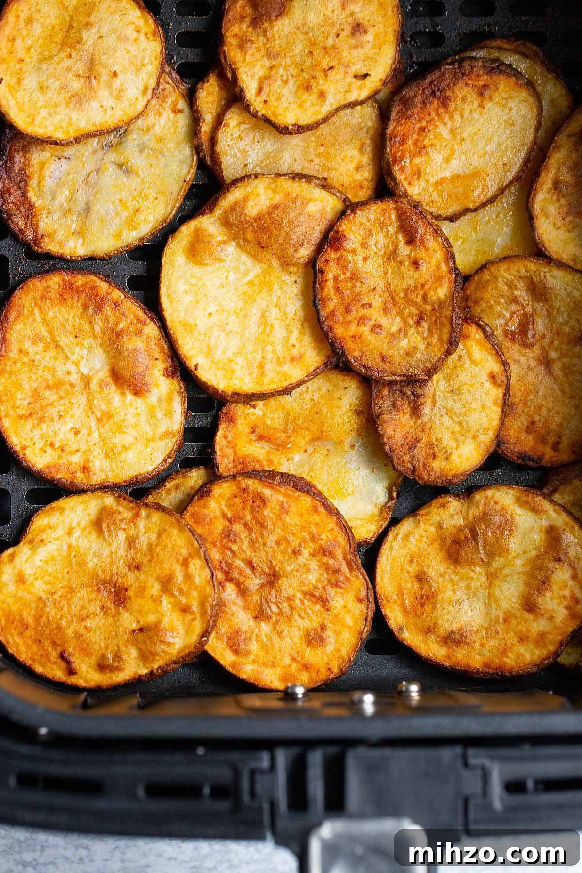 Crispy Air Fryer Sliced Potatoes Recipe 5 Cooked potato slices in air fryer basket
