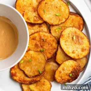 Crispy Air Fryer Sliced Potatoes Recipe 7 Air fryer potato slices with a dipping sauce.