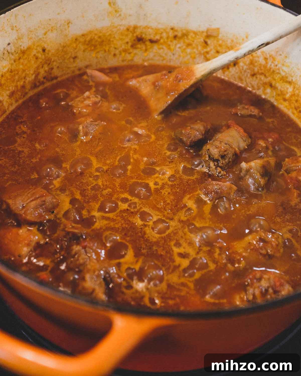 Cavatelli with Pork Ragù | cookeatworld.com Pork ragu simmering in a pan