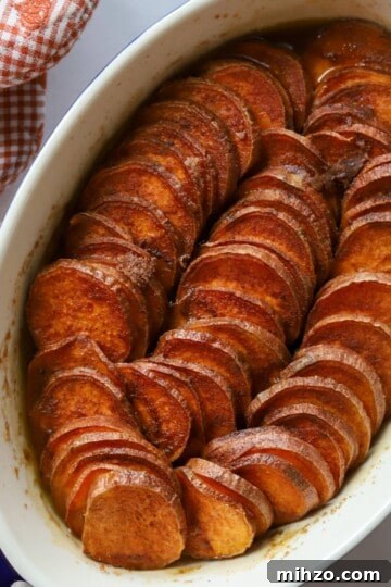 Baked Sweet Potatoes in casserole dish.