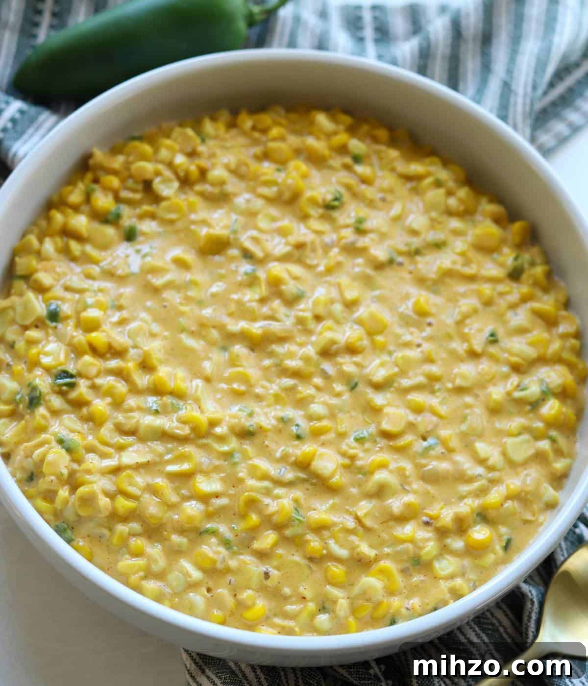 Creamed Corn with Jalapeño: Spicy Southwestern Side Dish 8 Cheesy Jalapeno Creamed Corn in bowl.