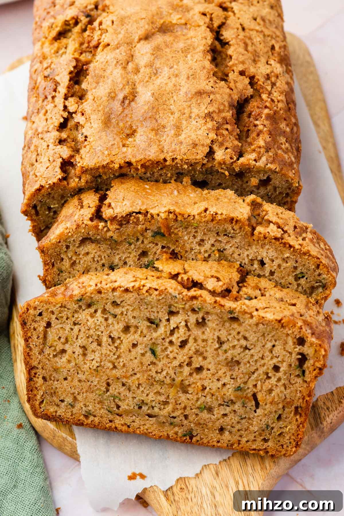 Moist Gluten-Free Zucchini Bread Recipe for Baking Success 2 Two slices of gluten-free zucchini bread leaning against the rest of the loaf.