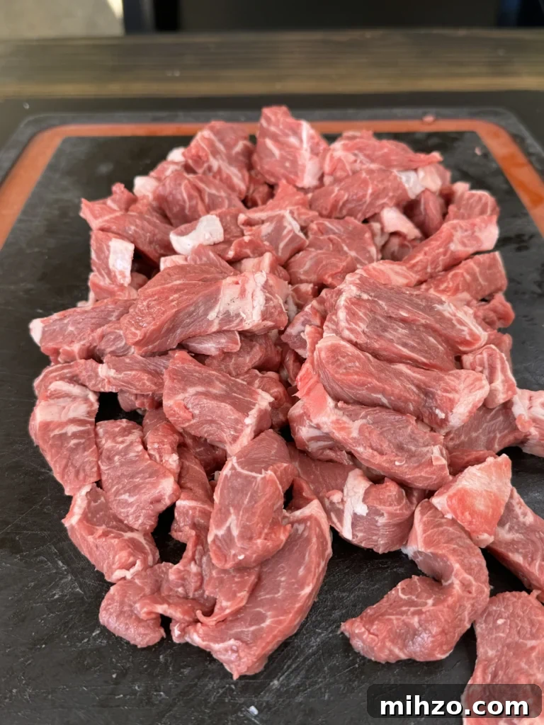 Pepper Steak Quesadillas Recipe: Quick Savory Filled Tortillas 5 steak cut up on the cutting board