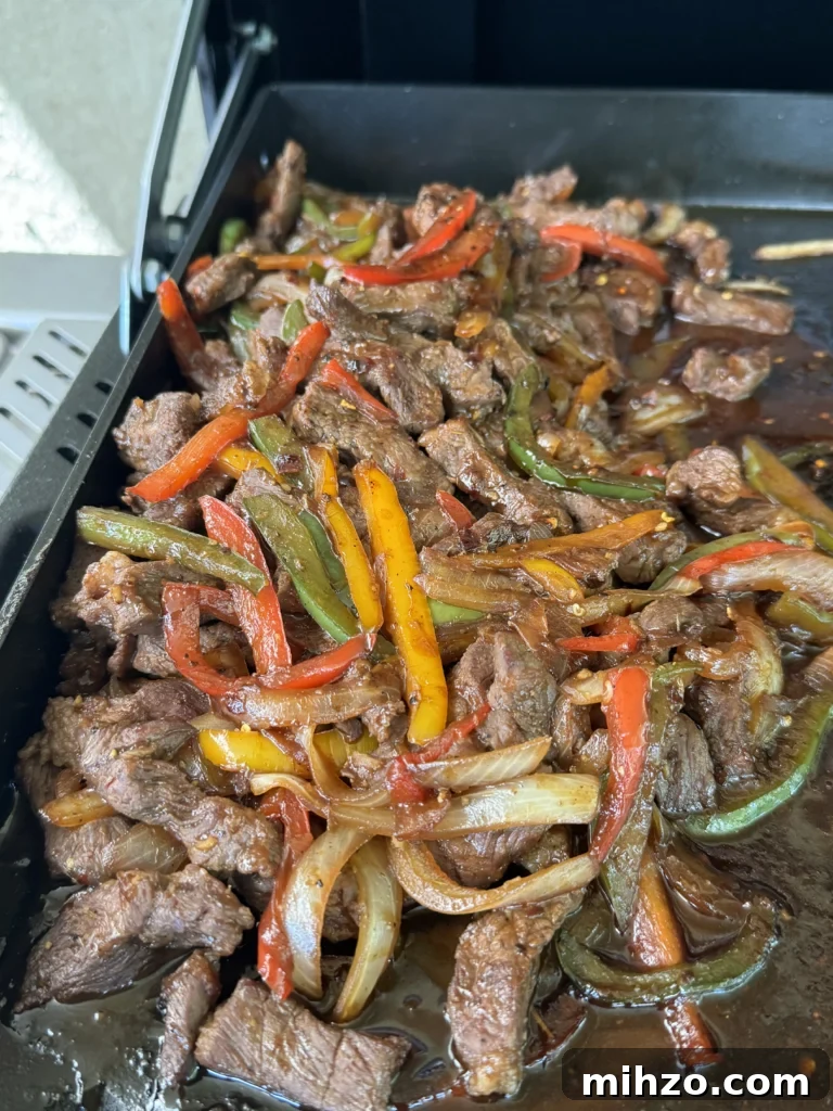 Pepper Steak Quesadillas Recipe: Quick Savory Filled Tortillas 6 steak and peppers on the griddle top