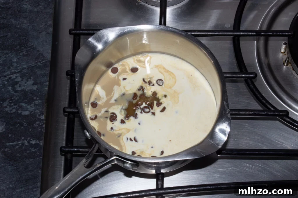 No-Bake Baileys Cheesecake Recipe: Creamy Irish Cream Dessert 14 Chocolate chips, Baileys, double cream and sugar in a saucepan over a low heat