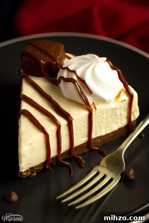 No-Bake Baileys Cheesecake Recipe: Creamy Irish Cream Dessert 16 A slice of no bake Baileys cheesecake on a dark grey plate surrounded by chocolate chips