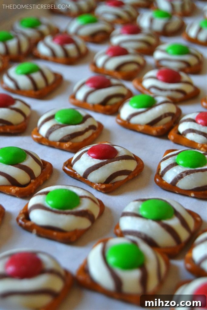 Christmas pretzel hugs arranged on a piece of parchment paper