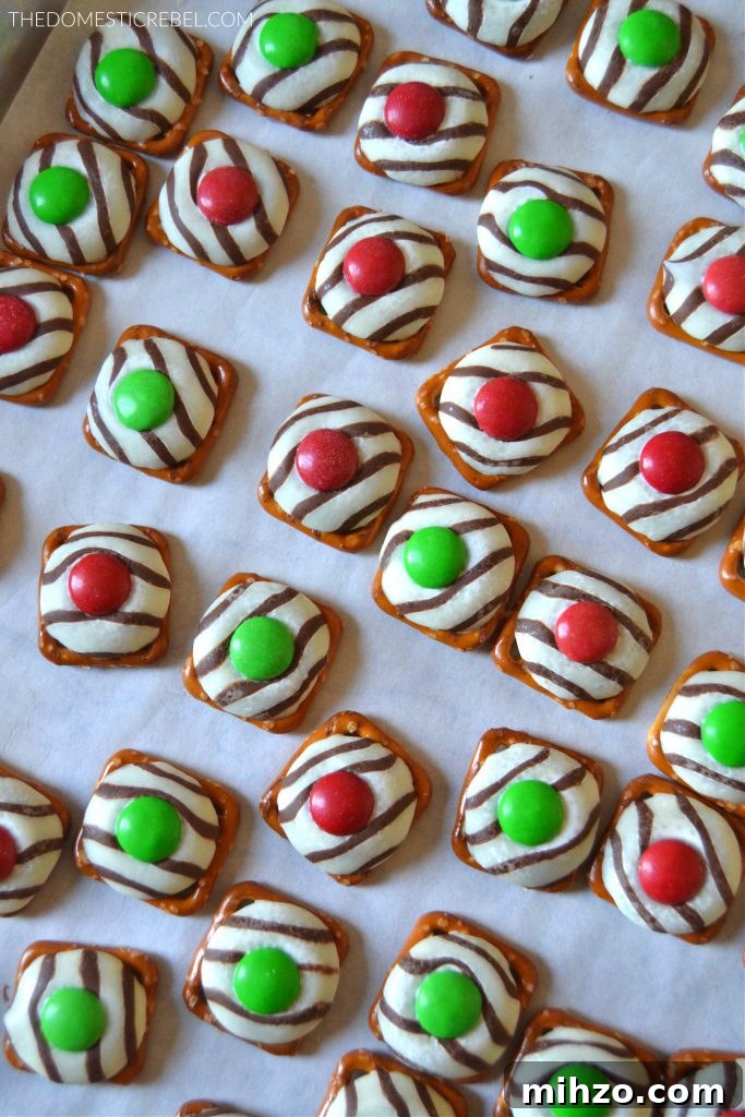 Baking sheet filled with Christmas pretzel hugs