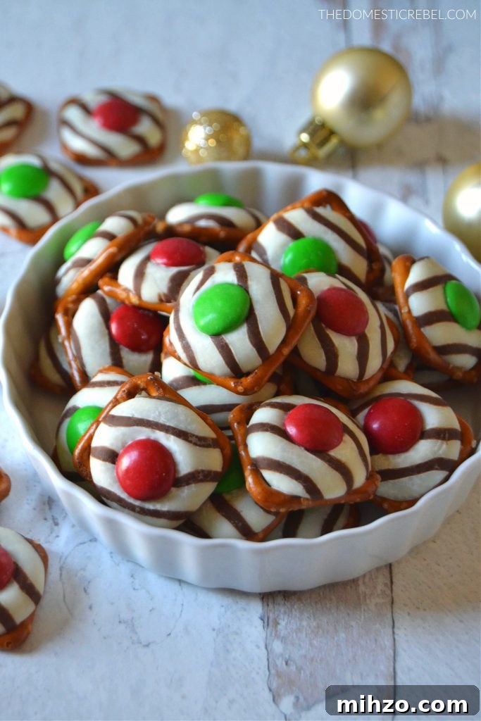 Christmas pretzel hugs in a white dish with gold ornaments