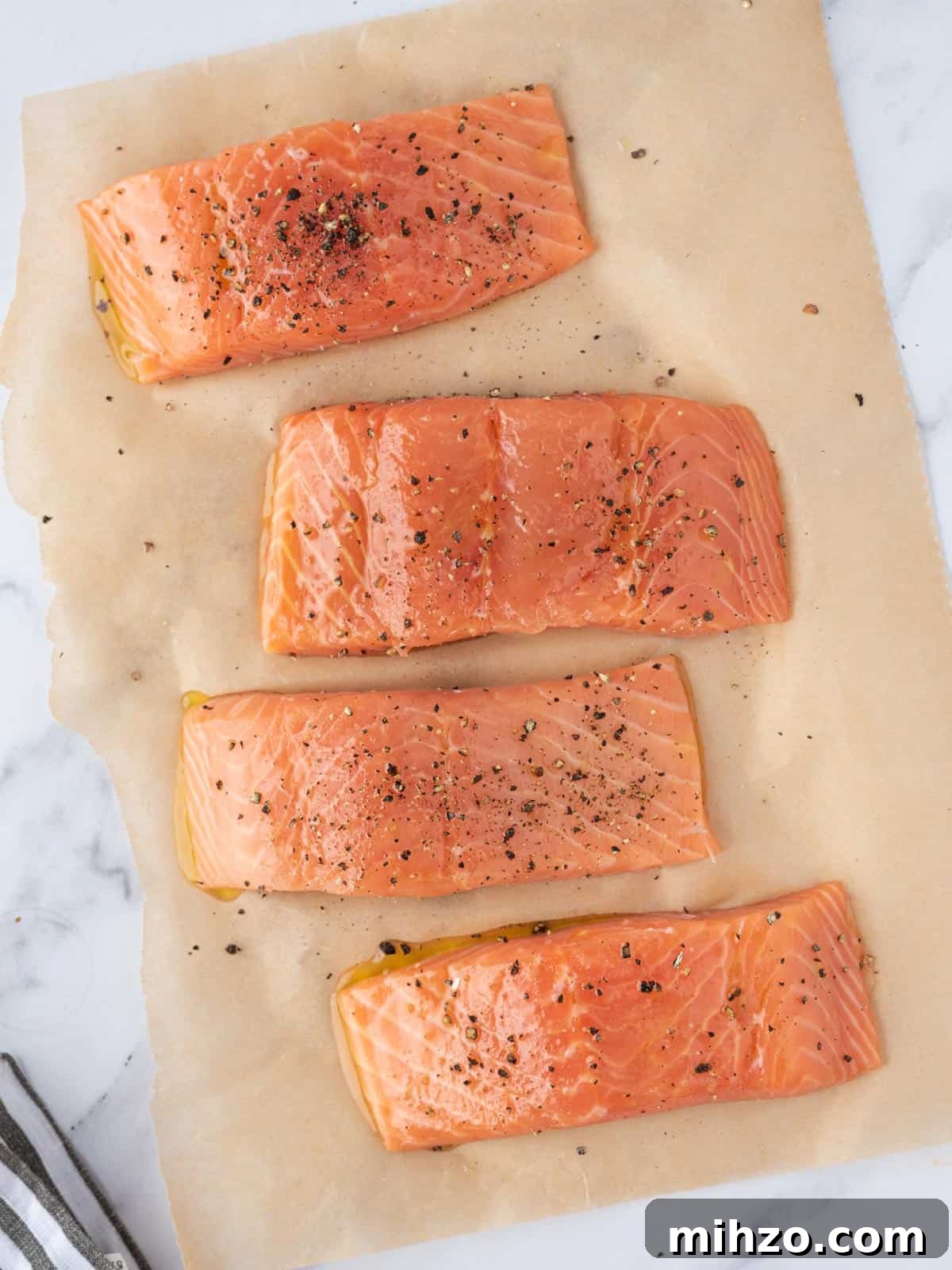 Creamy Spinach-Stuffed Salmon Fillets with Garlic Butter 4 Salmon fillets seasoned.