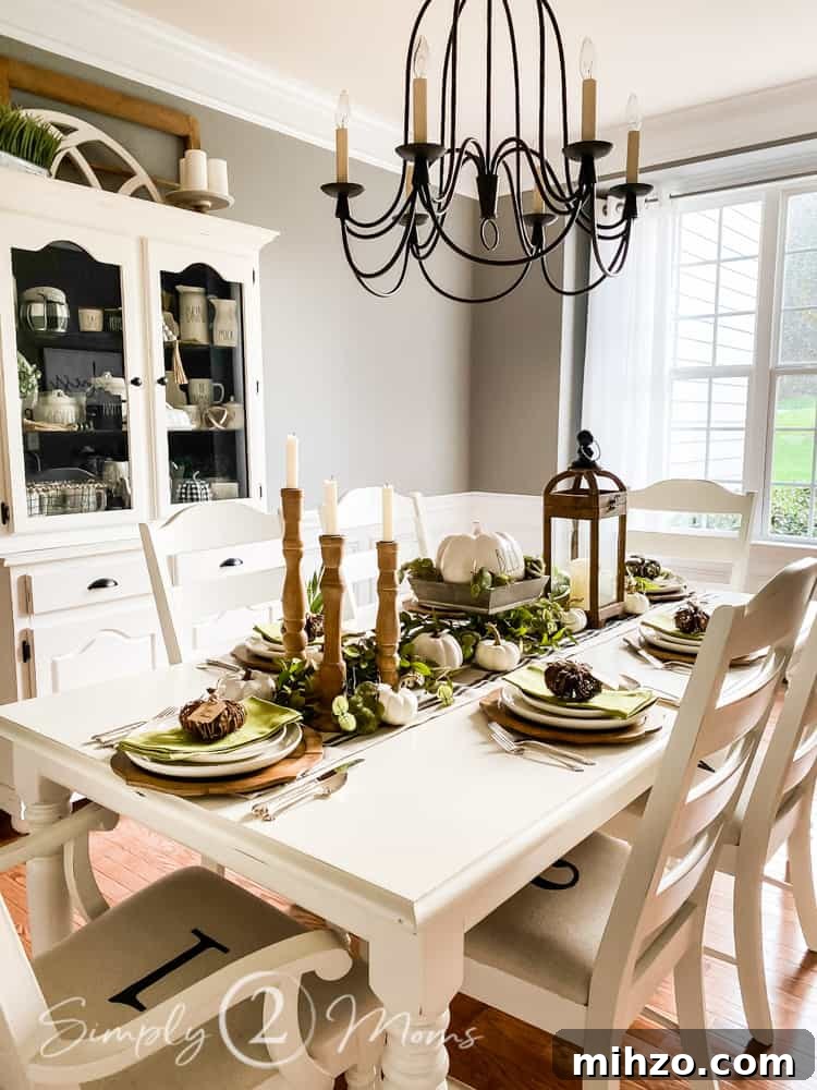 13+ Creative Ways to Make Your Thanksgiving Memorable 2 dining room with table and six chairs chandelier hanging over table and china cabinet to left of table windows at far end of room