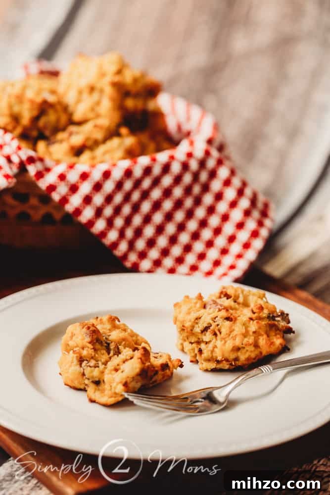 13+ Creative Ways to Make Your Thanksgiving Memorable 11 basket of keto bacon cheddar biscuits in background, plate with 2 biscuits in foreground