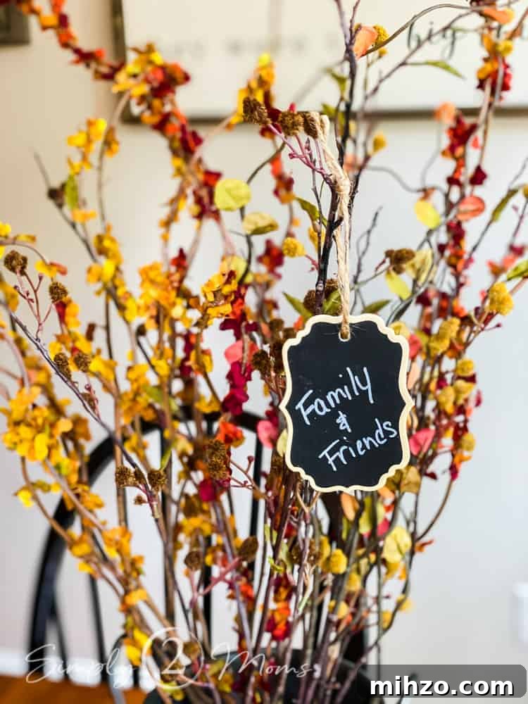 13+ Creative Ways to Make Your Thanksgiving Memorable 7 close up of thankful tree with chalkboard tag hanging from it