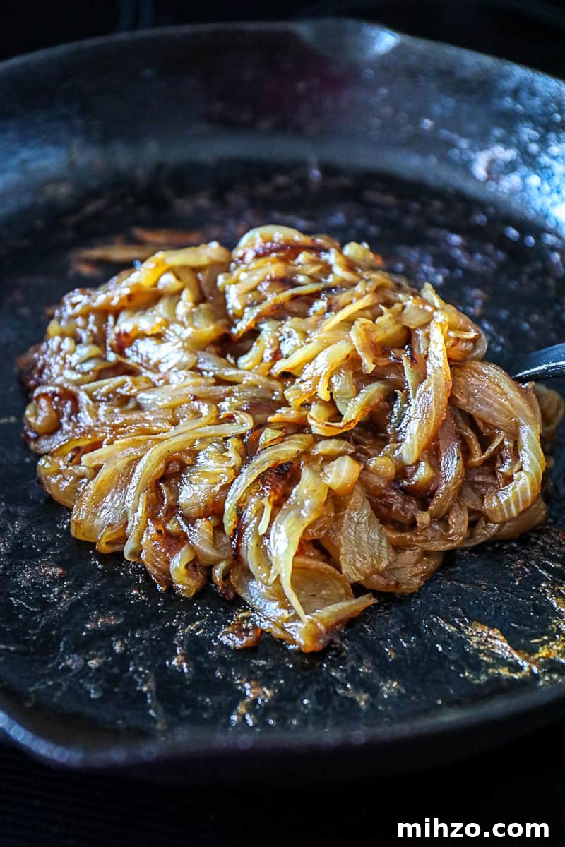 Caramelized Onions Recipe for Steaks, Burgers & Side Dishes 7 Cooking Caramelized Onions on the stove.
