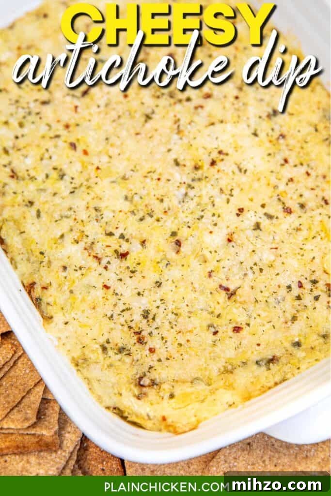 baking dish of artichoke dip surrounded by wheat thins on a table with text overlay