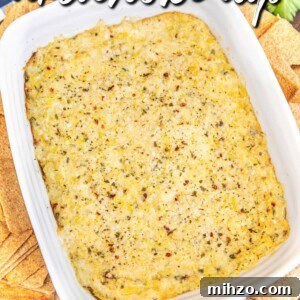 baking dish of artichoke dip surrounded by wheat thins on a table with text overlay