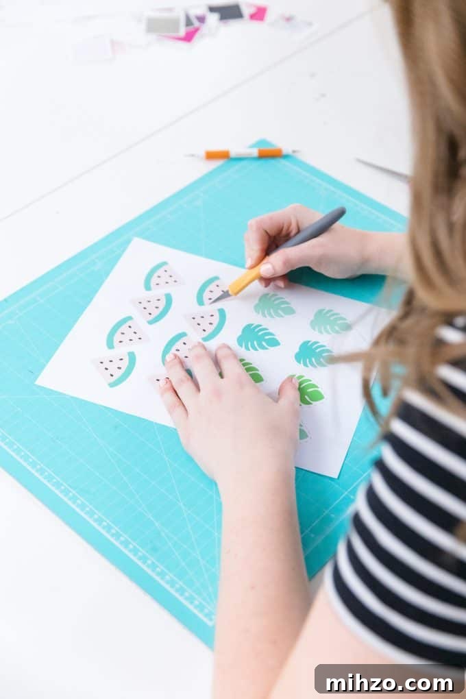 Craft Room Makeover Ideas: Transform Your Creative Space 4 Cutting watermelon printable cupcake toppers with an exacto knife.