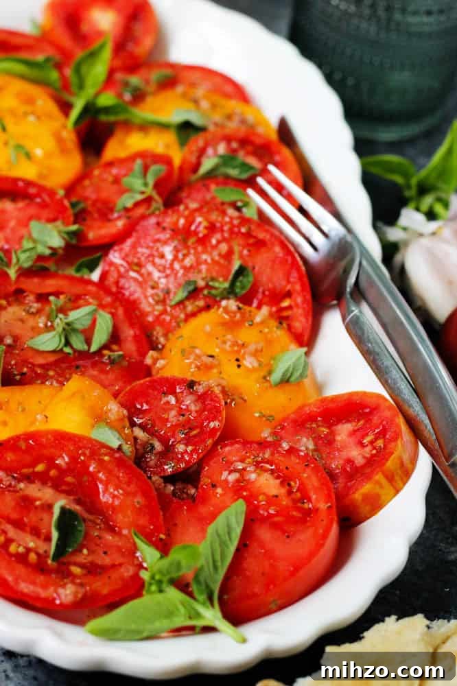 Heirloom Tomato Salad with Garlic, Oregano & Basil Dressing 12 Closeup of this heirloom tomato salad recipe