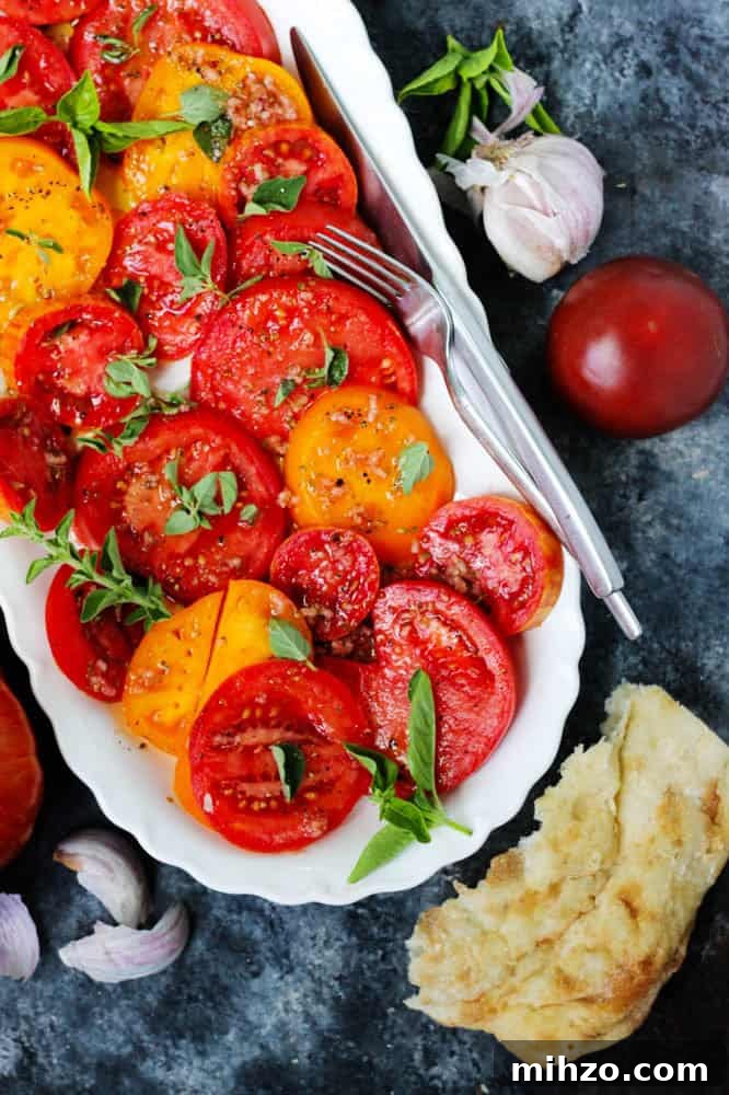 Heirloom Tomato Salad with Garlic, Oregano & Basil Dressing 13 Overhead view of tomato garlic salad