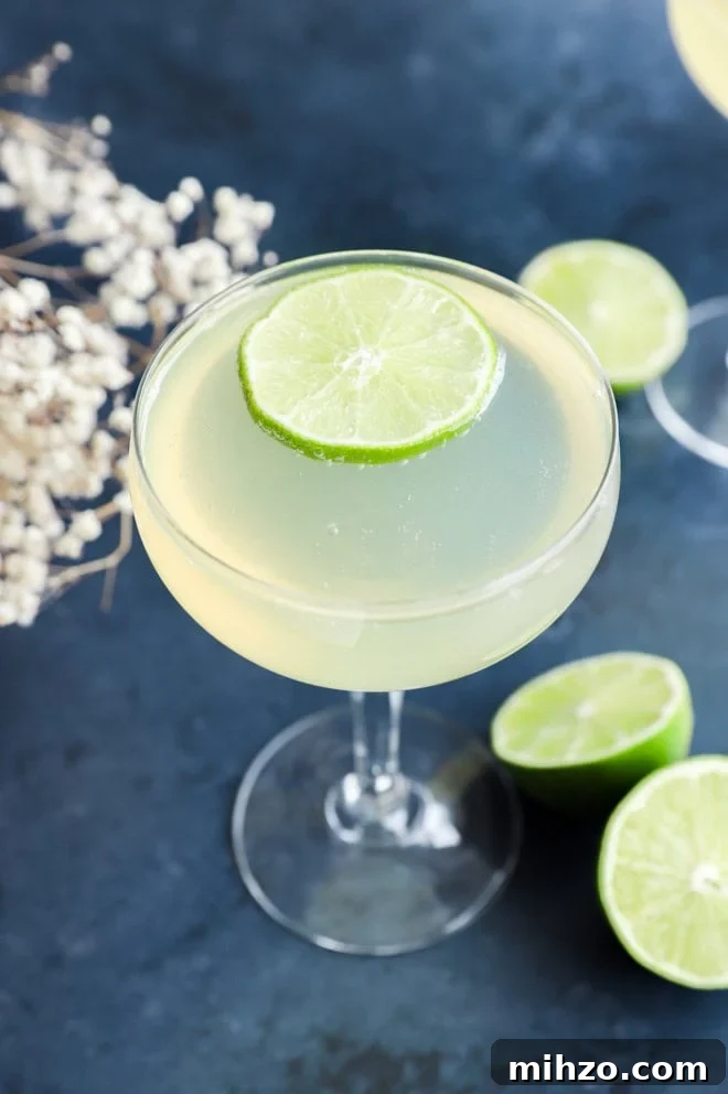 Elderflower Sparkling Cocktail Guide 2 easy champagne drink in coupe glass with limes