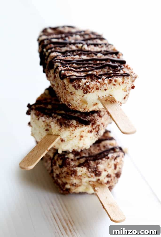 Gluten-Free Chocolate Éclair Ice Cream Bars (Good Humor Copycat) 6 Stack of chocolate eclair ice cream bars on white surface