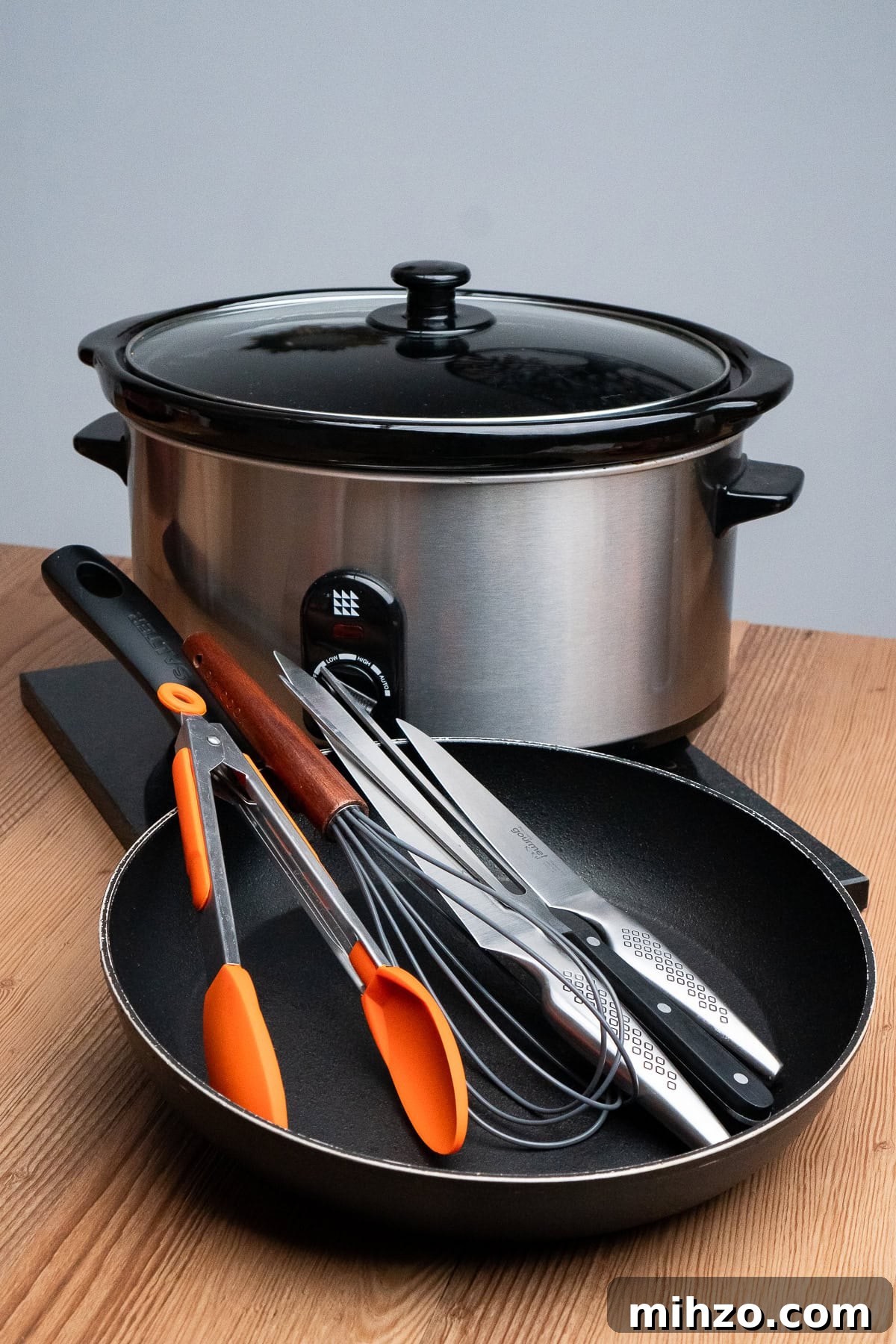 A slow cooker, frying pan,tongs, whisk, sharp knifes and meat fork