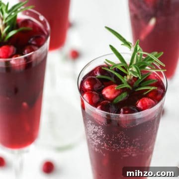 Cranberry Mimosa Recipe: Festive Brunch Cocktail Guide 9 4 glasses of mimosa with cranberry juice.