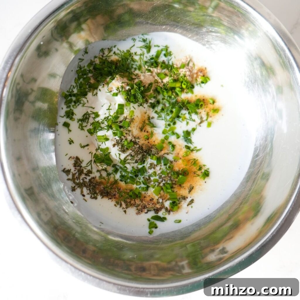 Homemade buttermilk ranch dressing ingredients in a mixing bowl.