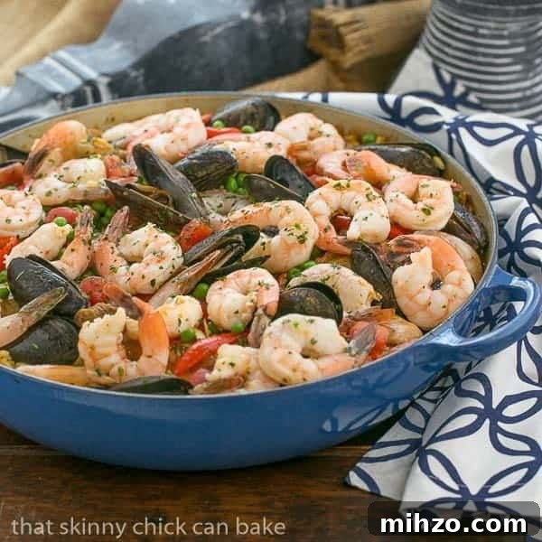 Paella a l'Americaine | Julia's twist on an extraordinary Spanish Classic with rice, saffron, shrimp, mussels and chorizo