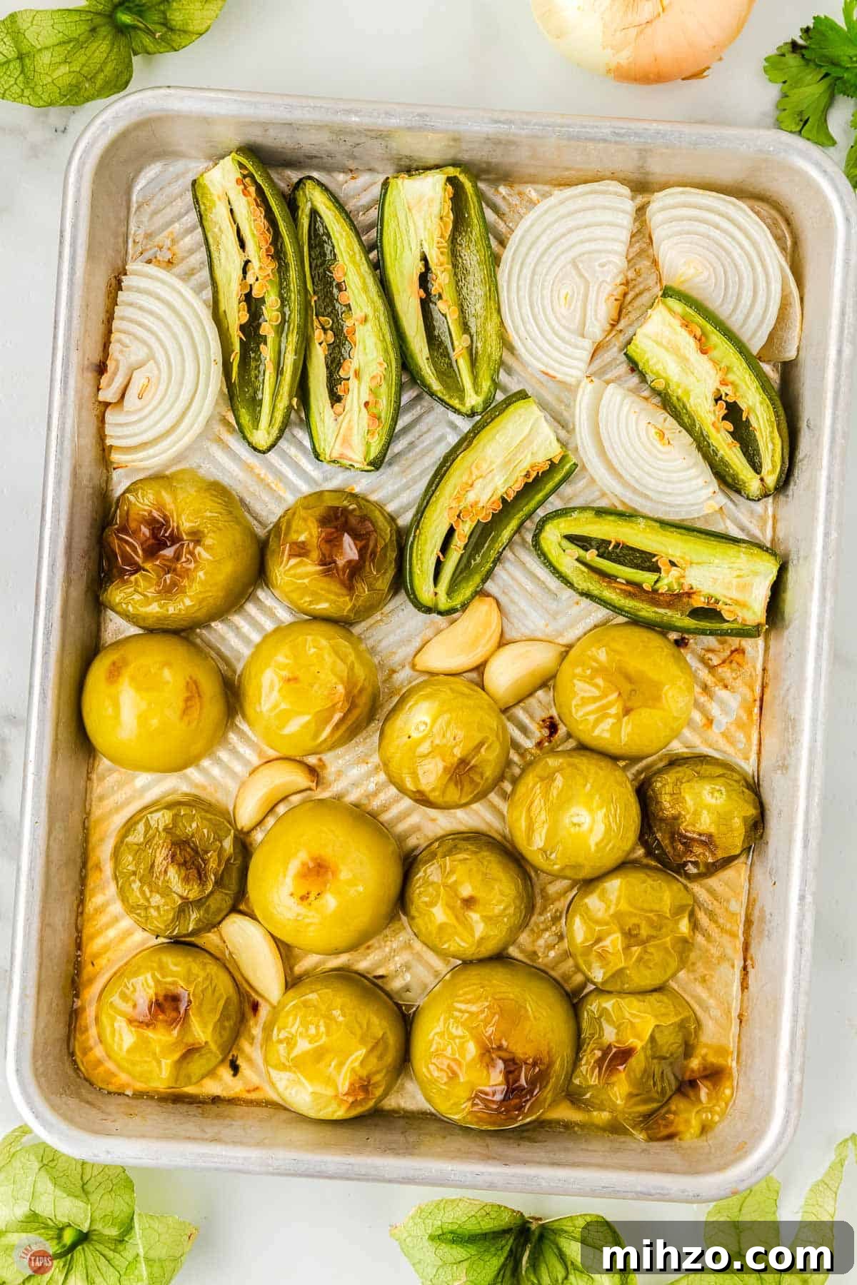 remove the cooked tomatillos with a slotted spoon and set aside