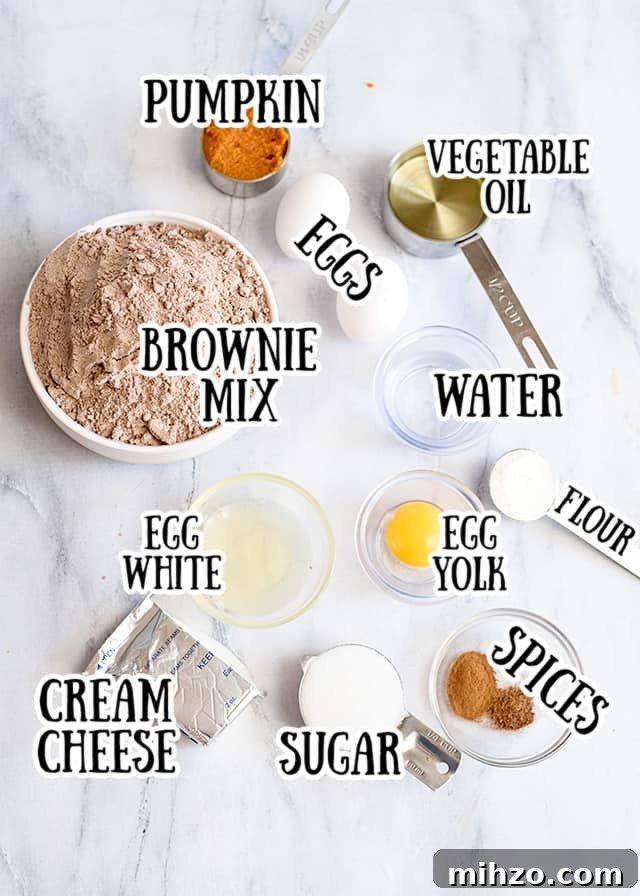 ingredients for pumpkin brownies on a marbled background with text