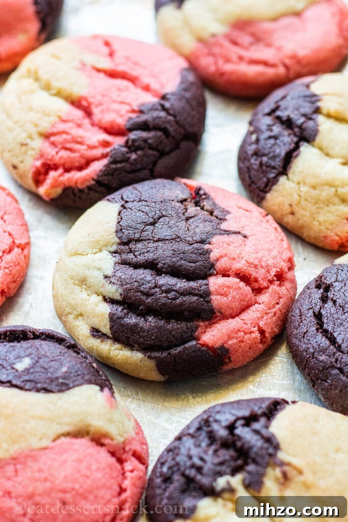 Authentic Neapolitan Cookies Recipe: Classic Layered Biscuits 2 Baked neapolitan cookies on a metal pan.