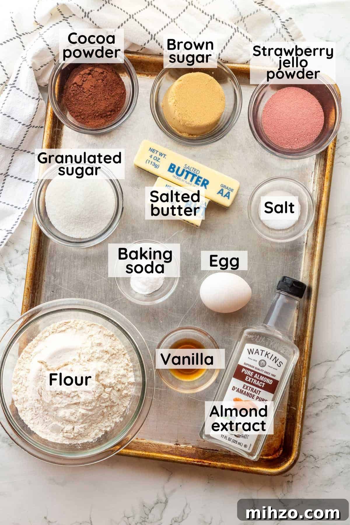 Authentic Neapolitan Cookies Recipe: Classic Layered Biscuits 3 Labeled ingredients for neapolitan cookies in glass bowls on metal baking sheet.