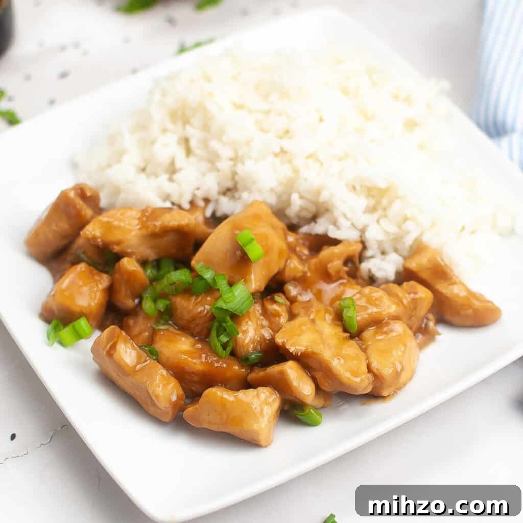 Slow Cooker Teriyaki Chicken Recipe for Tender, Flavorful Meals 2 teriyaki chicken and rice on white plate